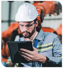 A construction worker looking at a tablet