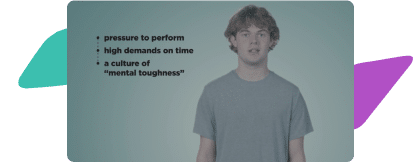 A young man stands in front of a blue background and discusses mental well-being for athletes.