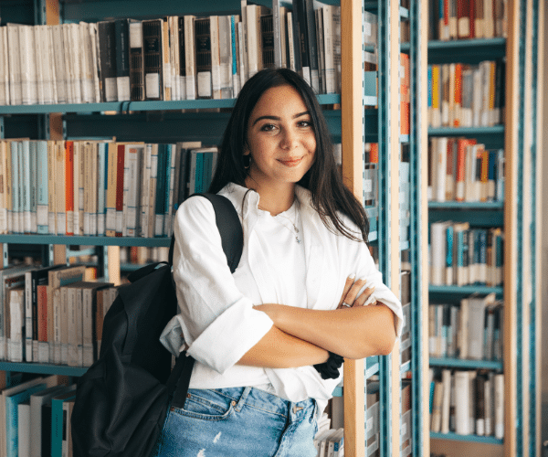 college student in front of books